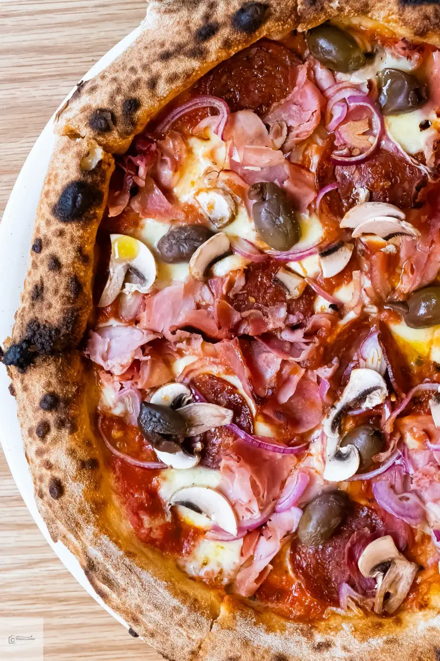 Rotonda Pizza capricciosa — prosciutto cotto, salami, mushrooms and Kalamata olives on a wood-fired Neapolitan base, Sydney pizza catering